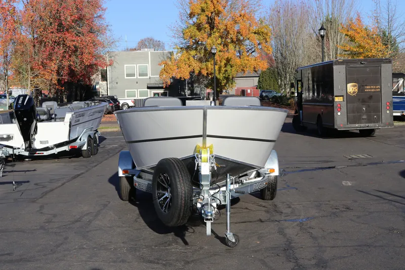 Slide: The Image of 2027 Alumaweld Adventurer 20 boat on trailer in parking lot with autumn trees. - 2