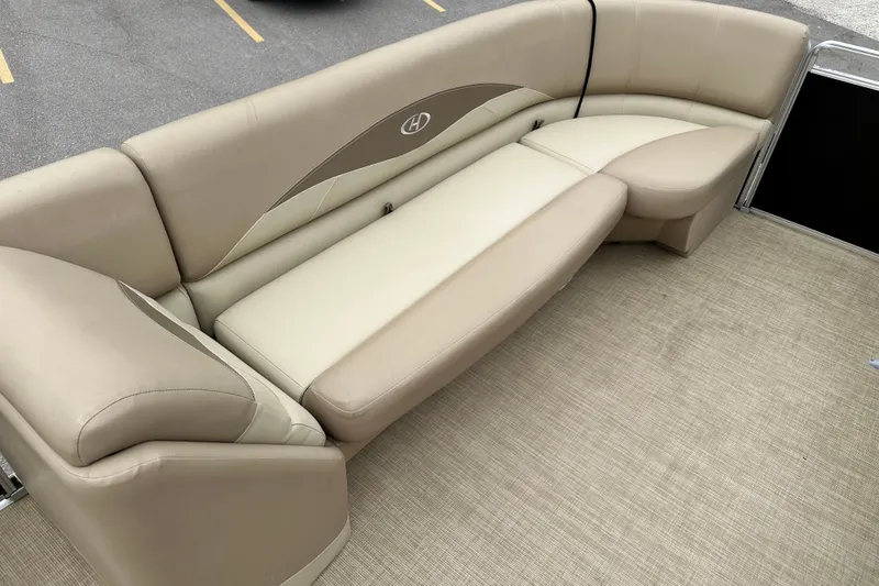Slide: The Image of Beige seating on 2016 Harris Cruiser 240 pontoon boat, featuring comfortable upholstery and spacious design. - 7
