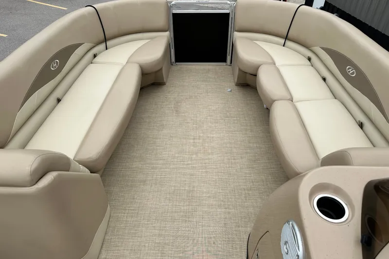 Slide: The Image of The image shows the interior of a 2016 Harris Cruiser 240 with beige seating. - 6