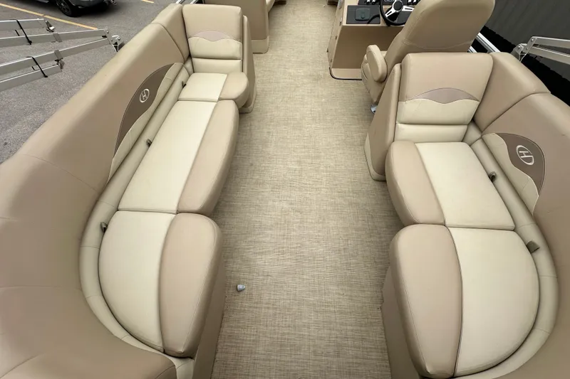 Slide: The Image of Interior of a 2016 Harris Cruiser 240 pontoon boat with beige seating. - 12