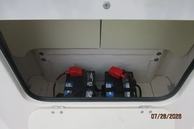 Slide: The Image of Battery compartment of 2000 Grady-White F-26 Tigercat boat, showing two batteries. - 26