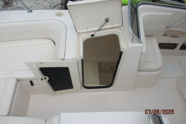 Slide: The Image of 2000 Grady-White F-26 Tigercat boat interior with open storage compartments. - 39