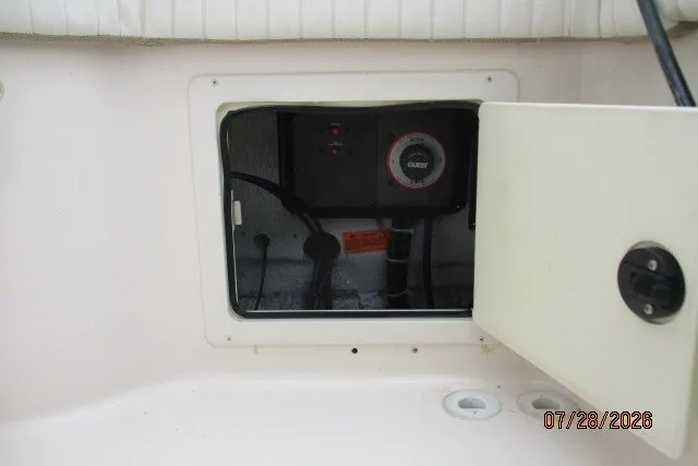 Slide: The Image of 2000 Grady-White F-26 Tigercat boat compartment with open access panel. - 24