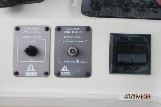 Slide: The Image of Control panel of a 2000 Grady-White F-26 Tigercat boat with anchor windlass switches. - 12