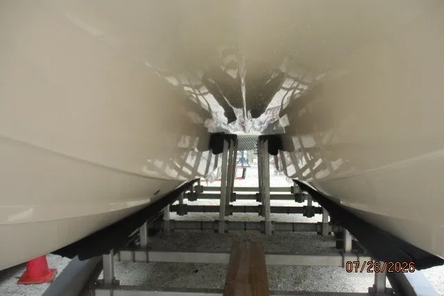 Slide: The Image of Underneath view of a 2000 Grady-White F-26 Tigercat boat on a trailer. - 16