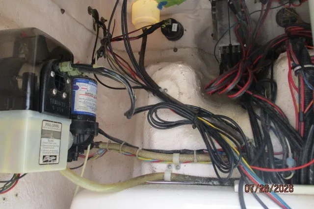 Slide: The Image of Wiring and components inside a 2000 Grady-White F-26 Tigercat boat. - 52