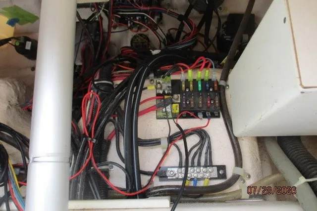Slide: The Image of Electrical wiring and fuse panel inside a 2000 Grady-White F-26 Tigercat boat. - 51