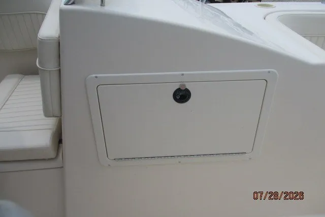 Slide: The Image of Grady-White F-26 Tigercat 2000 boat interior with storage compartment and seating. - 36