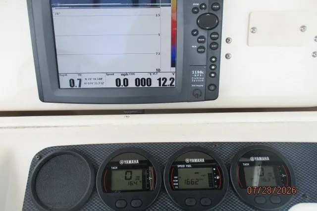 Slide: The Image of Dashboard of a 2000 Grady-White F-26 Tigercat with Yamaha gauges and GPS display. - 30