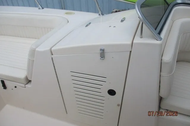 Slide: The Image of 2000 Grady-White F-26 Tigercat boat interior with seating and storage compartment. - 37