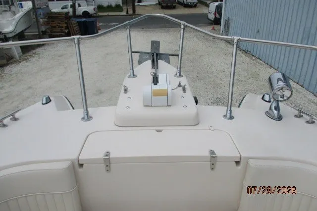Slide: The Image of 2000 Grady-White F-26 Tigercat boat deck with anchor and railing. - 46