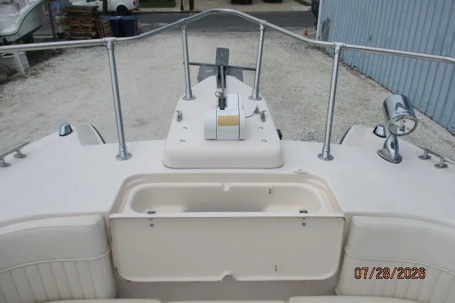 Slide: The Image of 2000 Grady-White F-26 Tigercat boat deck with anchor and storage compartment. - 47