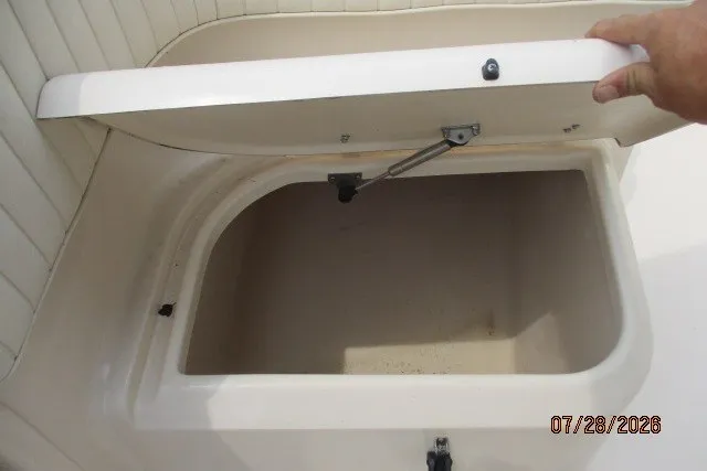 Slide: The Image of Open storage compartment on a 2000 Grady-White F-26 Tigercat boat. - 33