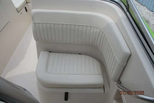 Slide: The Image of White cushioned seating on a 2000 Grady-White F-26 Tigercat boat. - 34