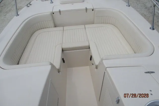 Slide: The Image of 2000 Grady-White F-26 Tigercat boat interior with cushioned seating area. - 43