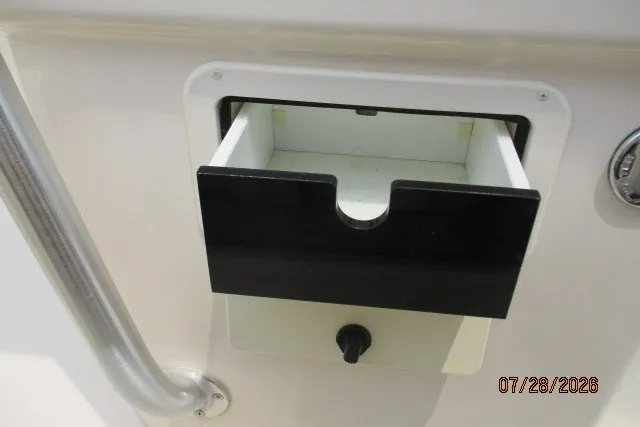 Slide: The Image of Open storage compartment on 2000 Grady-White F-26 Tigercat boat. - 31