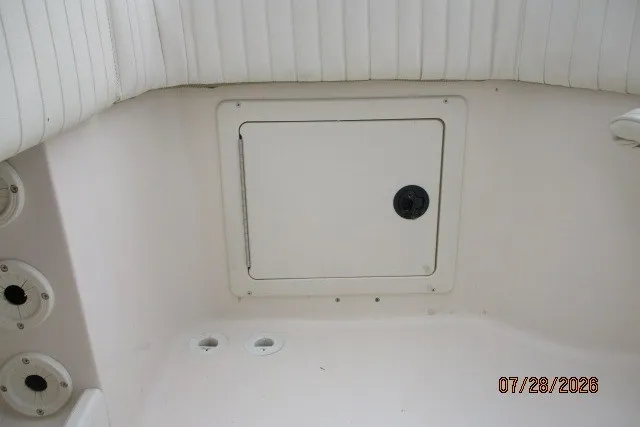Slide: The Image of 2000 Grady-White F-26 Tigercat boat interior with storage compartment. - 22