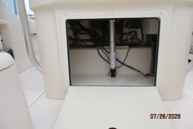 Slide: The Image of Grady-White F-26 Tigercat 2000 boat compartment with visible wiring and hydraulic components. - 50