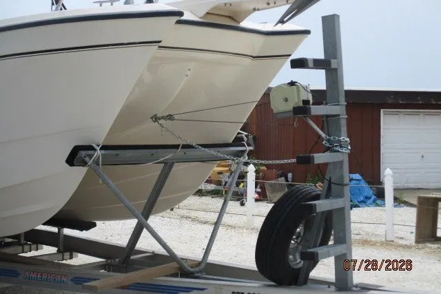 Slide: The Image of 2000 Grady-White F-26 Tigercat boat on trailer, parked outdoors. - 15