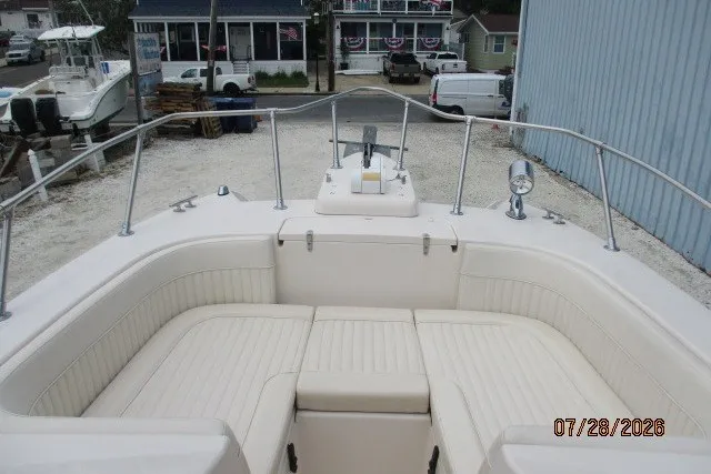 Slide: The Image of 2000 Grady-White F-26 Tigercat boat with spacious seating and stainless steel railings. - 44