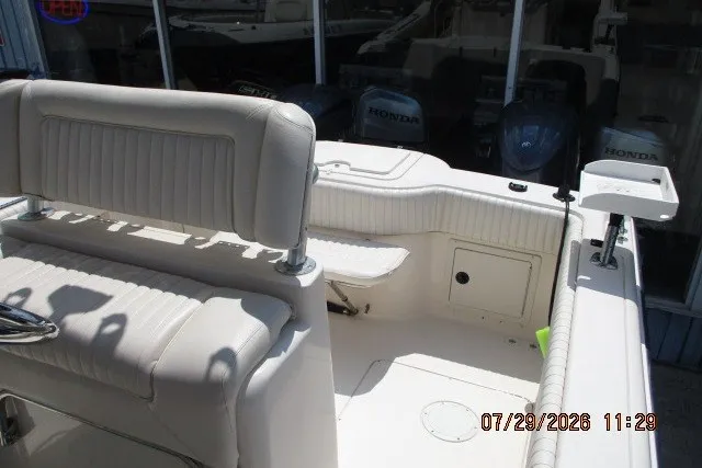 Slide: The Image of 2000 Grady-White X-26 Tigercat boat interior with white seating and Honda engines. - 56