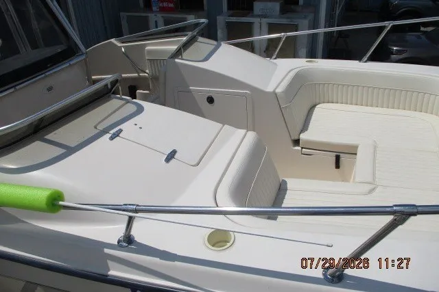 Slide: The Image of 2000 Grady-White X-26 Tigercat boat interior with seating and railing. - 63