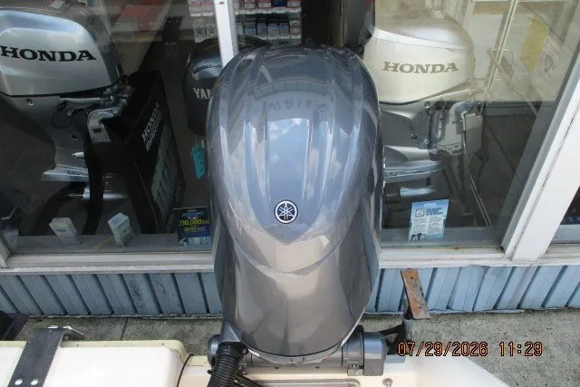 Slide: The Image of Outboard motors displayed, featuring Yamaha and Honda brands, on a Grady-White X-26 Tigercat boat. - 57