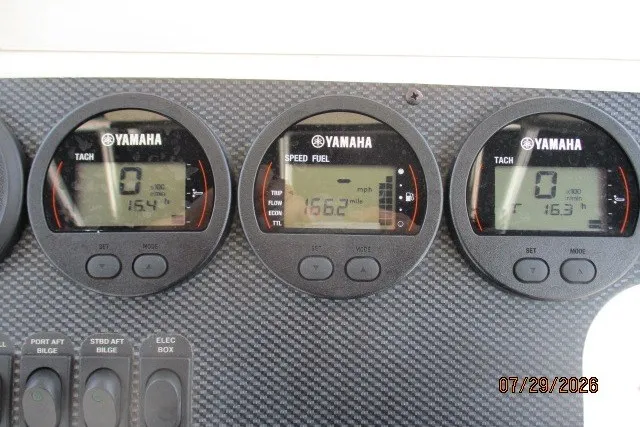 Slide: The Image of Yamaha gauges on a 2000 Grady-White X-26 Tigercat boat dashboard, displaying speed and fuel data. - 20