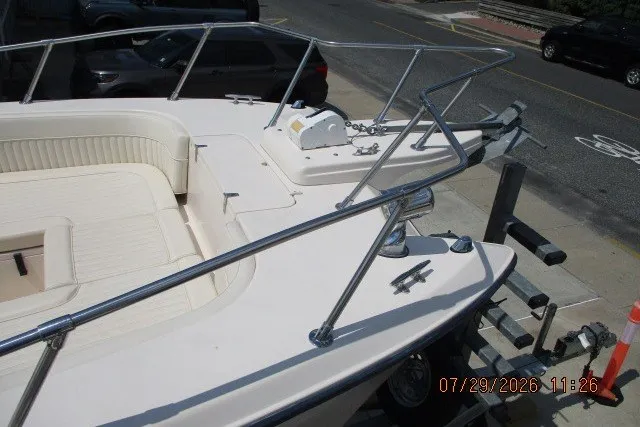 Slide: The Image of Bow of 2000 Grady-White X-26 Tigercat boat on trailer, featuring anchor and railing. - 62