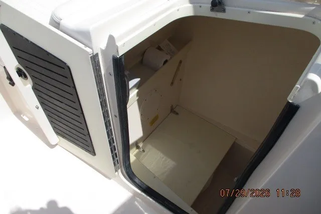 Slide: The Image of 2000 Grady-White X-26 Tigercat boat interior storage compartment. - 38