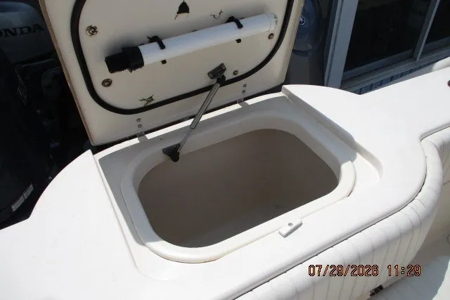 Slide: The Image of Open storage compartment on 2000 Grady-White X-26 Tigercat boat. - 59