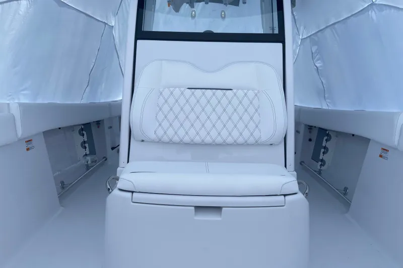 Slide: The Image of 2027 Sportsman Open 262 Center Console interior with white seating and modern design. - 9