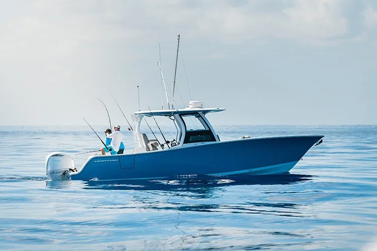 Slide: The Image of 2027 Sportsman Open 262 Center Console boat on calm ocean waters. - 1