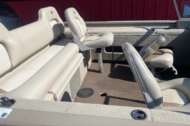 Slide: The Image of 2003 Smoker Craft Pro Angler 165 SC boat interior with beige seating and carpeted floor. - 6