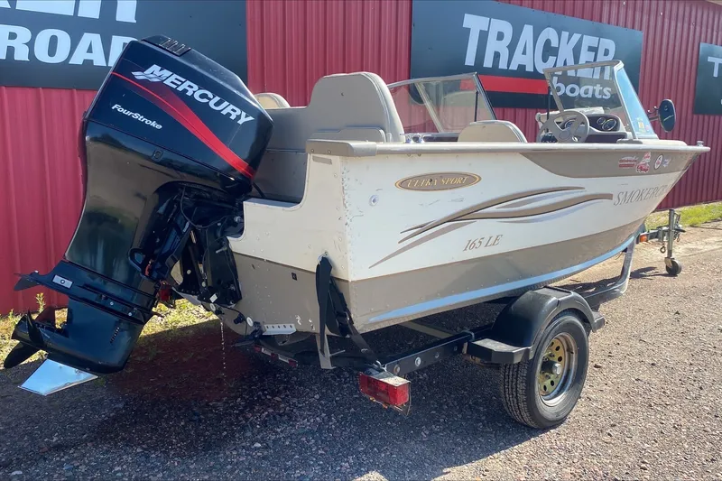 Slide: The Image of 2003 Smoker Craft Pro Angler 165 SC boat with Mercury FourStroke engine on trailer. - 4