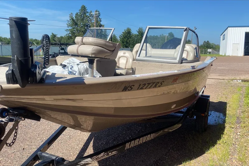 Slide: The Image of 2003 Smoker Craft Pro Angler 165 SC boat on trailer, parked outdoors. - 3