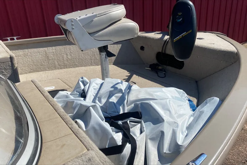 Slide: The Image of 2003 Smoker Craft Pro Angler 165 SC boat interior with seat and equipment. - 7