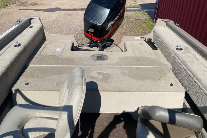 Slide: The Image of 2003 Smoker Craft Pro Angler 165 SC boat interior with Mercury engine and seating. - 9