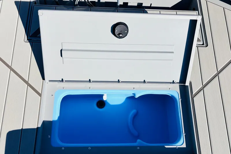 Slide: The Image of Open storage compartment on 2027 Tracker Bass Tracker Classic CC boat deck. - 31