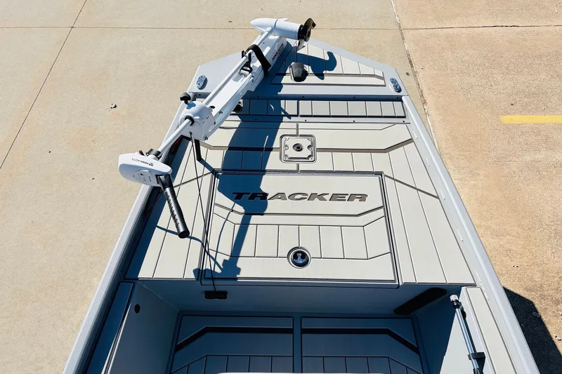 Slide: The Image of 2027 Tracker Bass Tracker Classic CC boat deck with mounted trolling motor. - 10