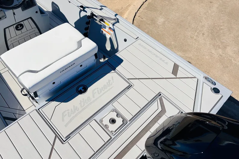 Slide: The Image of 2027 Tracker Bass Tracker Classic CC boat deck with seating and storage compartments. - 28