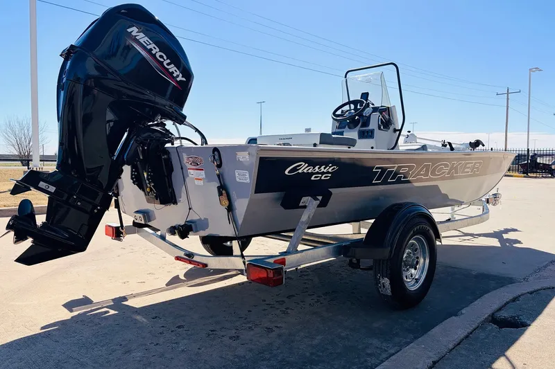 Slide: The Image of 2027 Tracker Bass Tracker Classic CC boat on trailer, featuring Mercury outboard motor. - 6