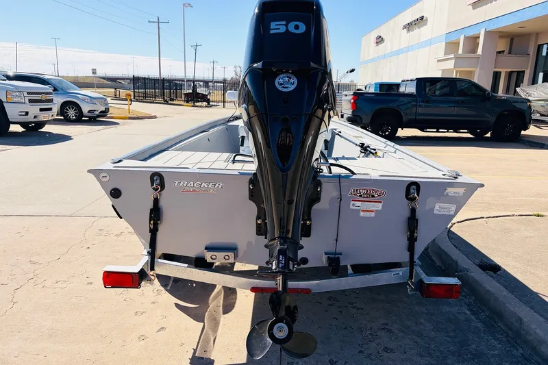 Slide: The Image of 2027 Tracker Bass Tracker Classic CC boat with 50 HP motor in a dealership lot. - 7
