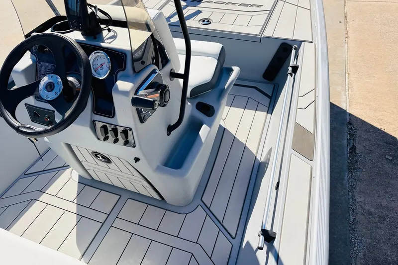 Slide: The Image of 2027 Tracker Bass Tracker Classic CC boat interior with steering wheel and control panel. - 19