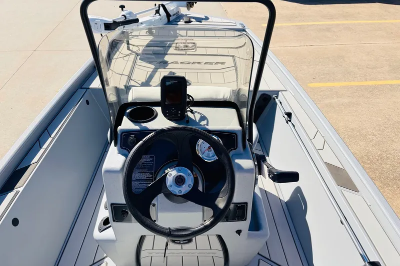 Slide: The Image of 2027 Tracker Bass Tracker Classic CC boat console with steering wheel and navigation system. - 20