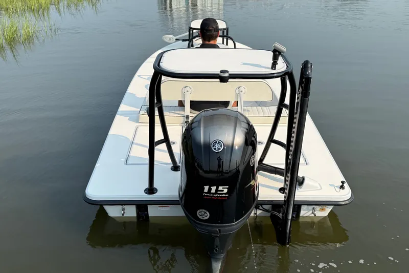 Slide: The Image of 2020 Maverick 18 HPX-V boat with Yamaha 115 engine on calm water. - 5