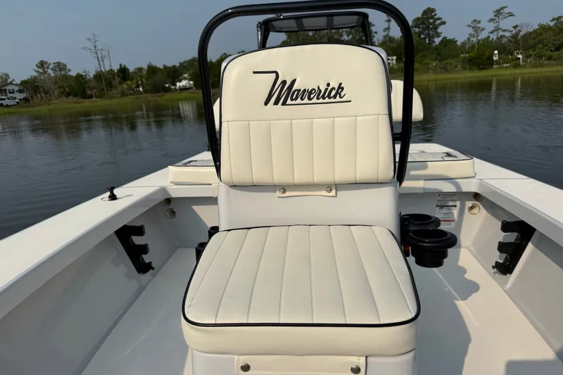 Slide: The Image of 2020 Maverick 18 HPX-V boat interior with white seating on calm water. - 25