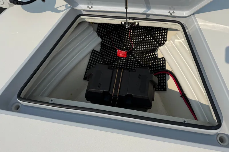 Slide: The Image of Open hatch of 2020 Maverick 18 HPX-V boat showing battery compartment and wiring. - 34