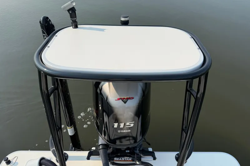 Slide: The Image of 2020 Maverick 18 HPX-V boat with Yamaha 115 engine on calm water. - 18