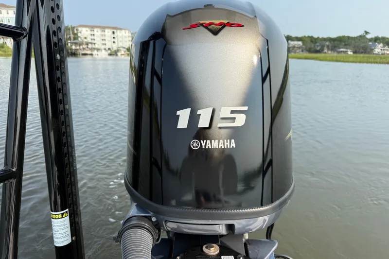 Slide: The Image of Outboard motor on 2020 Maverick 18 HPX-V boat, featuring Yamaha 115 engine. - 19